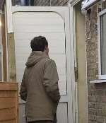 KM Group reporter Matt Hoople questions a woman at the property. Picture: TERRY SCOTT