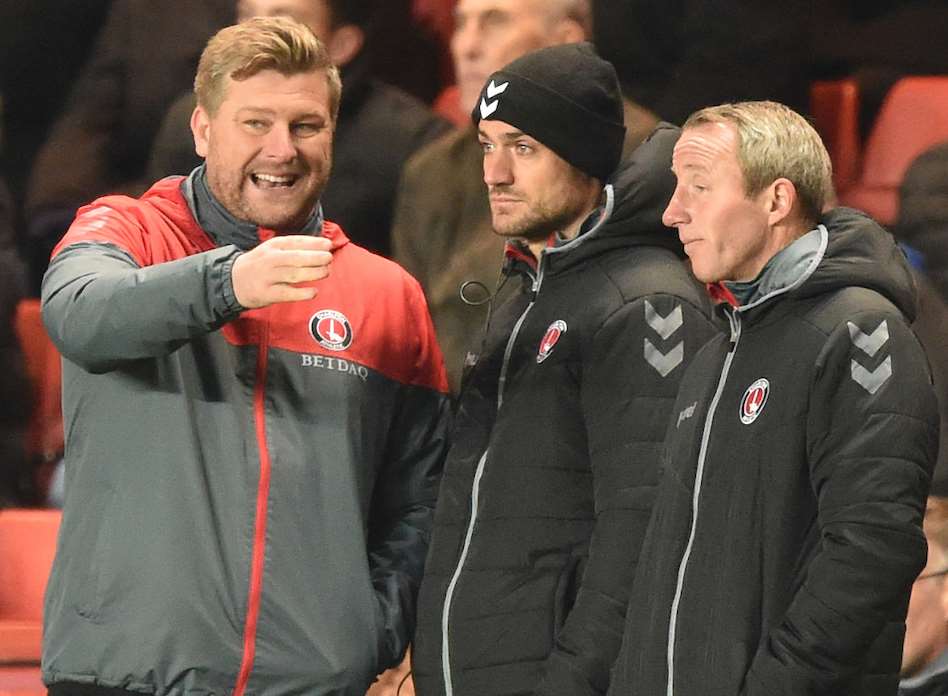 Charlton boss Karl Robinson talks tactics with his coaching staff. Picture: Keith Gillard