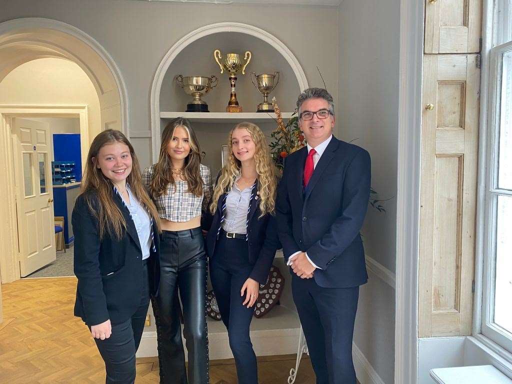 From left: A sixth-form student, Mimi Webb, another student and Principal Ben Charles on Mimi's visit to the school. Picture: King's School Rochester