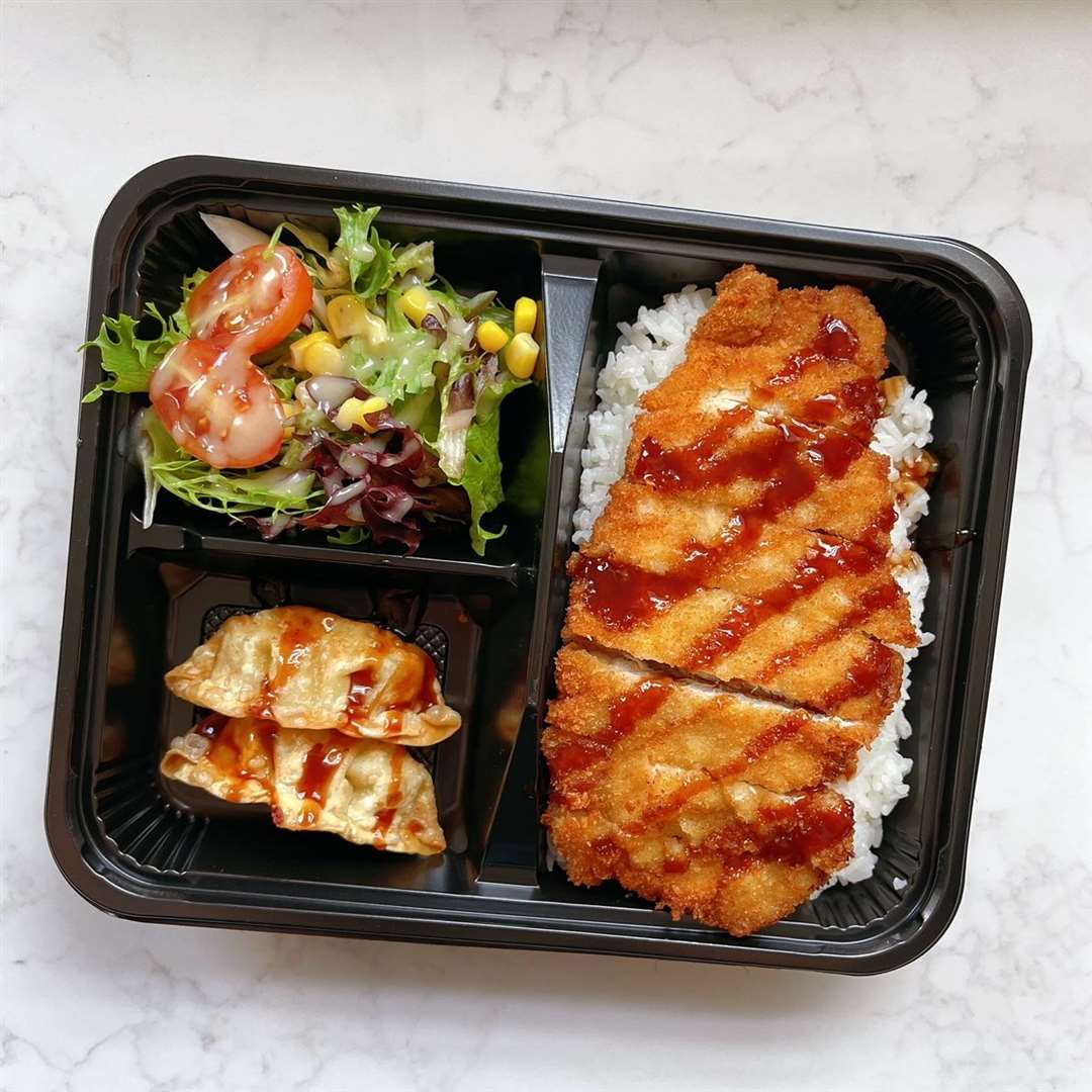 Bento: Katsu Pork Bento with deep fried gyoza, salad and rice. Picture: Sumo Sushi