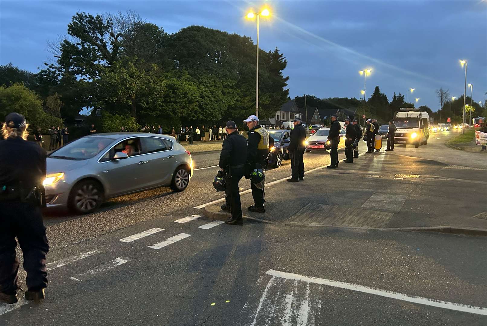 Police officers form a line at the protest outside Chatham Innovation Centre on August 7, 2024