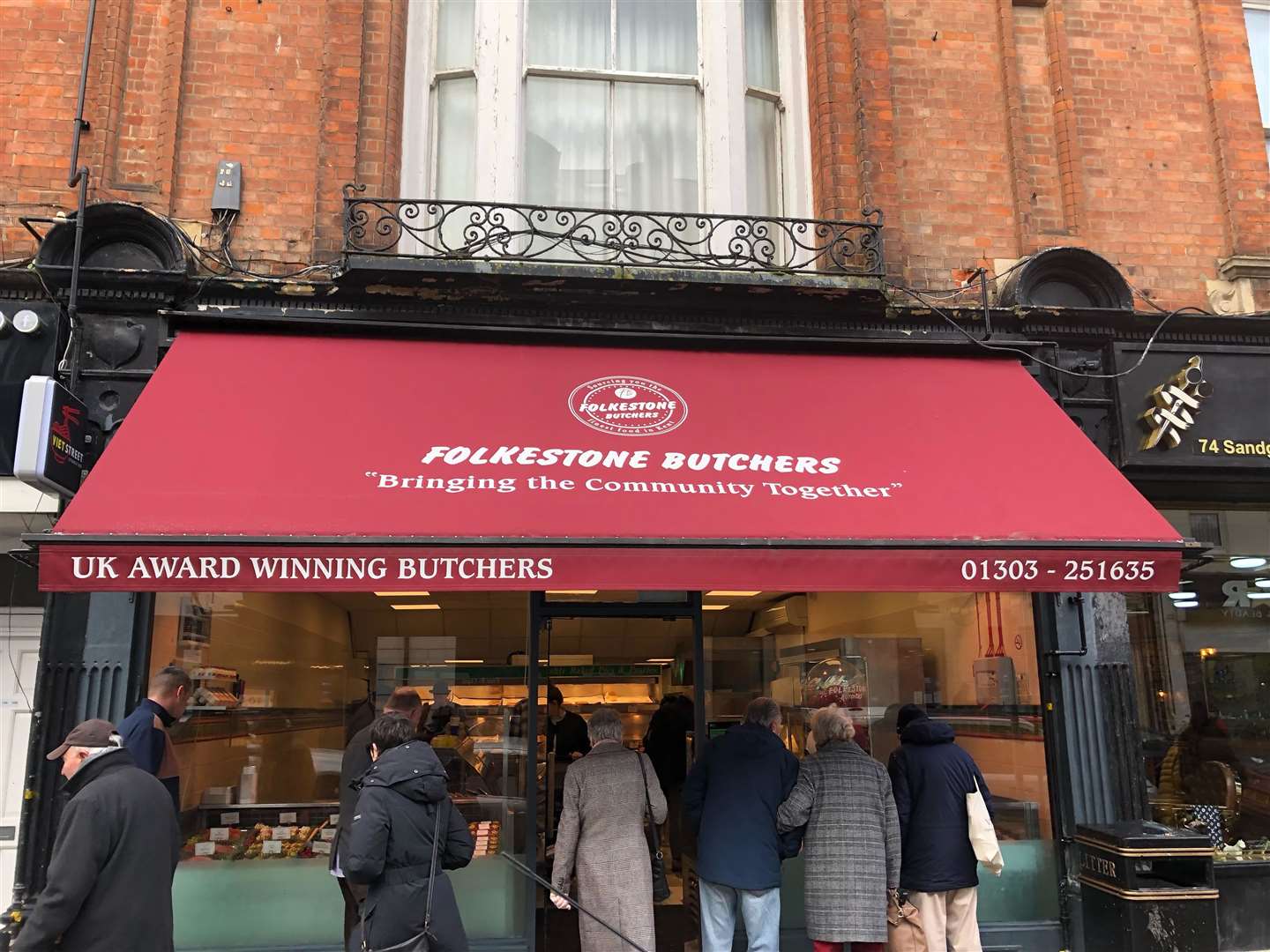 Customers gather round the new butcher shop in Sandgate Road which has had an encouraging start to business