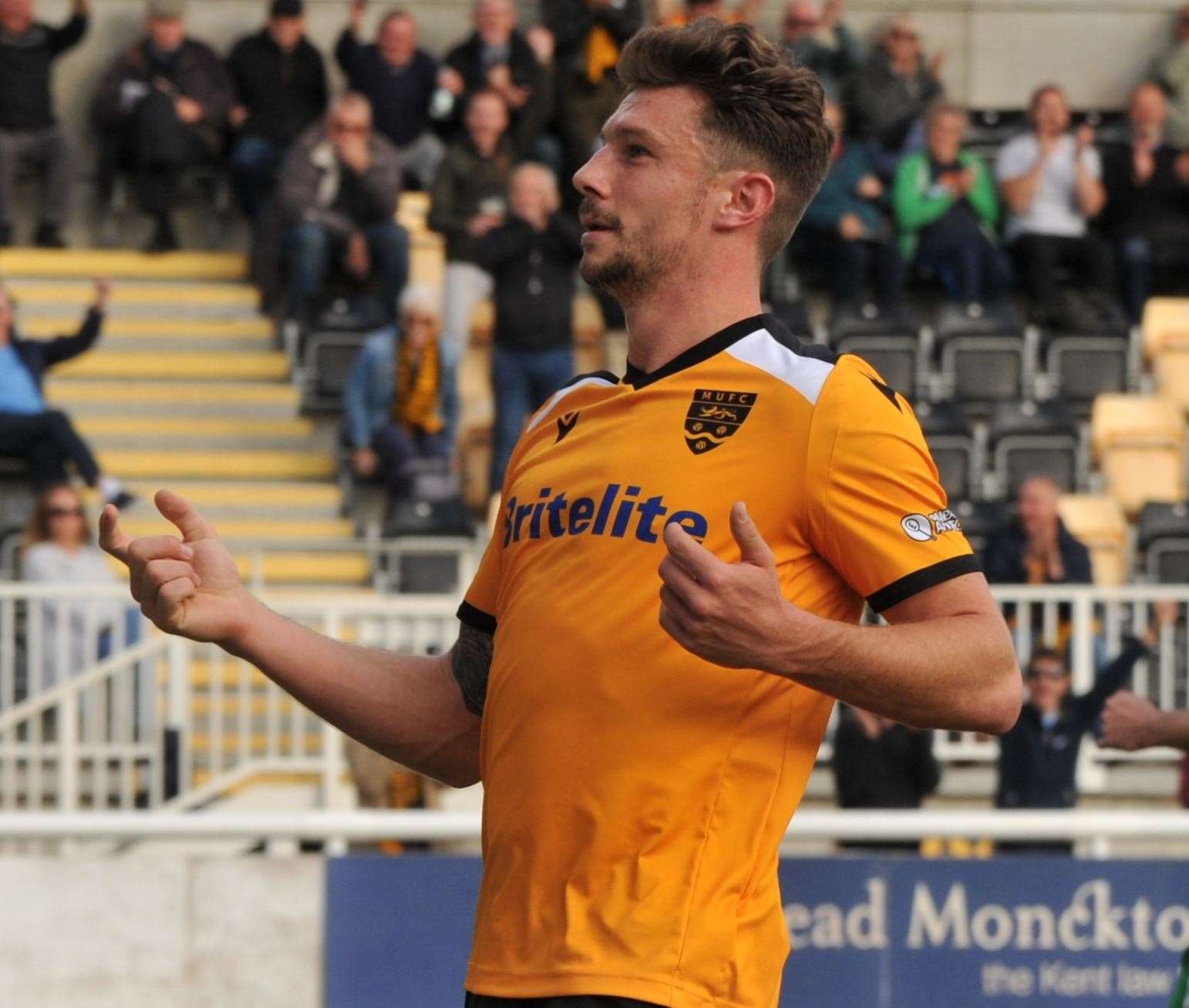 Maidstone striker Matt McClure celebrates his hat-trick goal against St Albans Picture: Steve Terrell