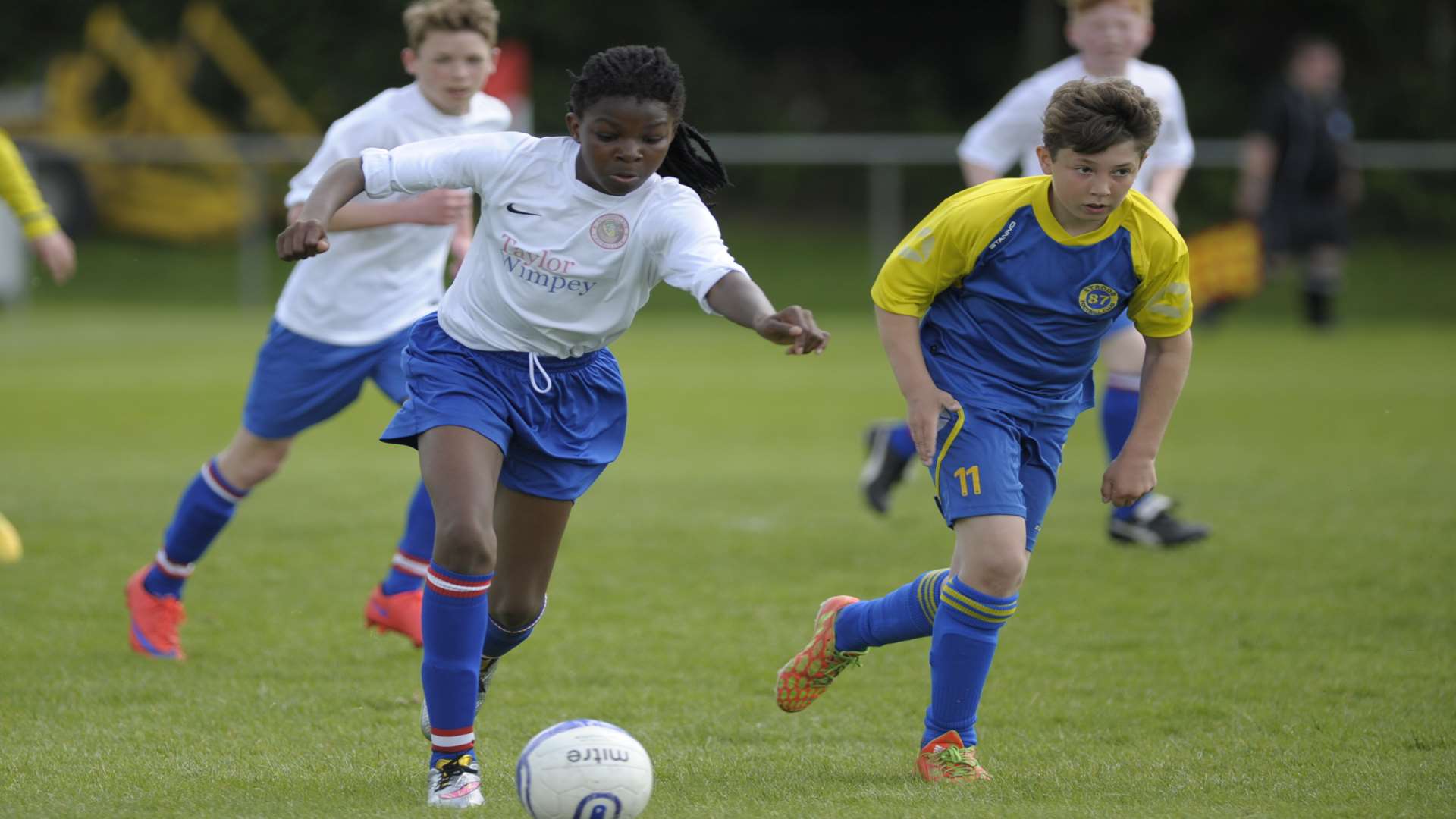 Woodpecker Hi under-13s (white) drive forward against Strood 87 in the John Leeds Trophy final Picture: Steve Crispe