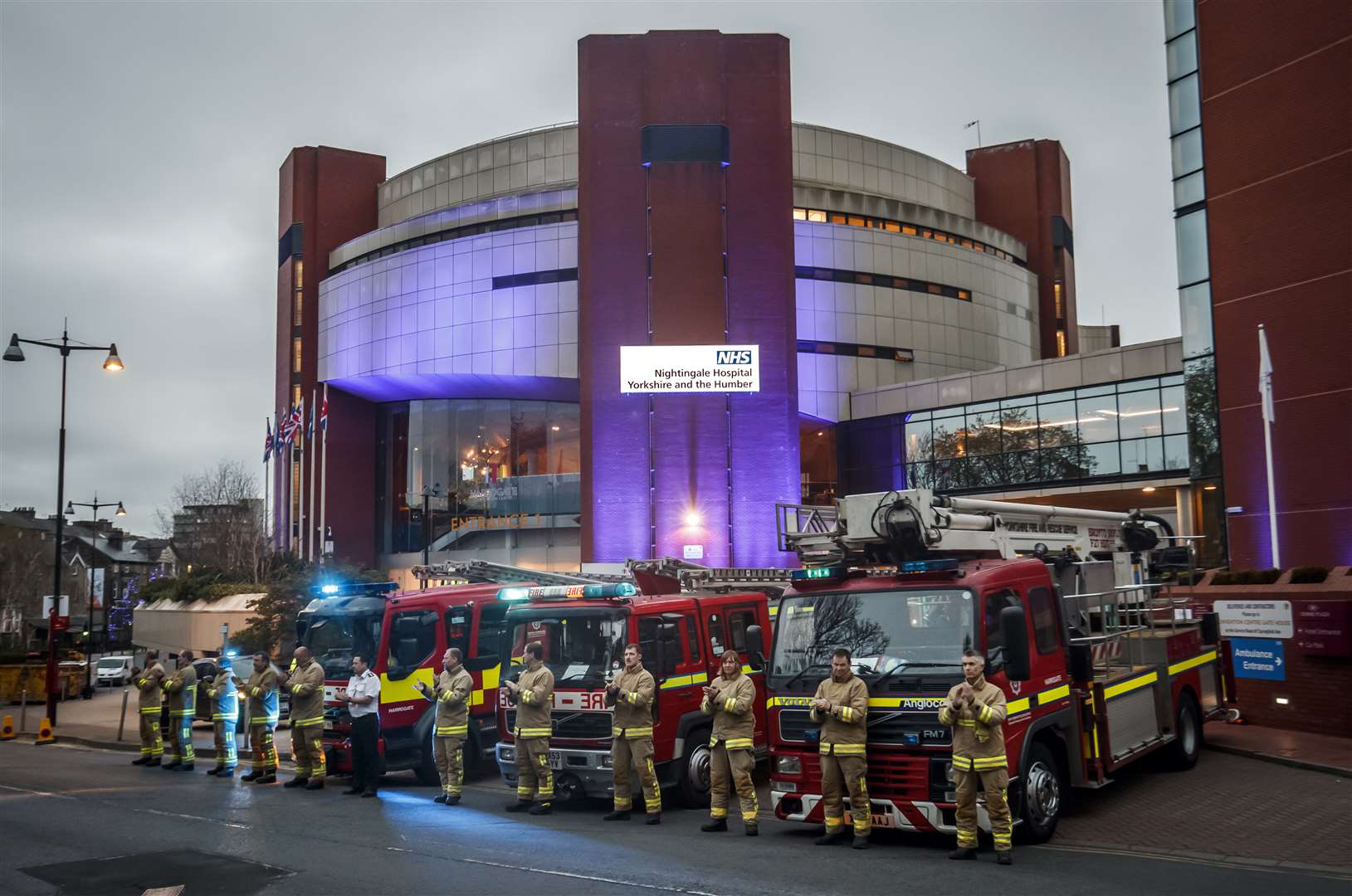 Members of the fire brigade clapping outside the Nightingale Hospital at the Harrogate Convention Centre last week (PA)