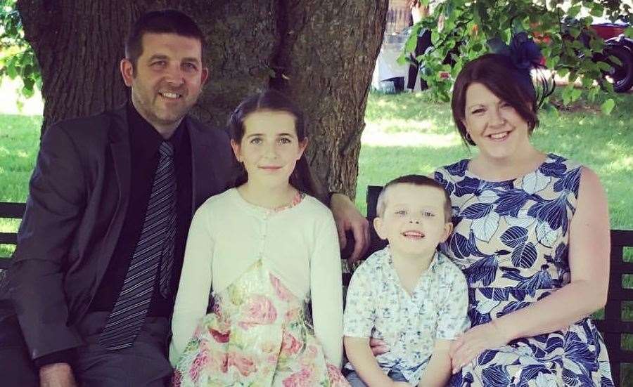 Joe with dad Michael, sister Lucy and mum Becky