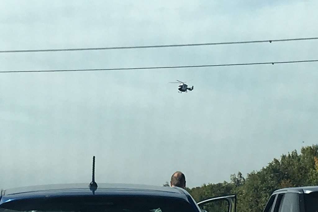 The air ambulance is landing on the carriageway