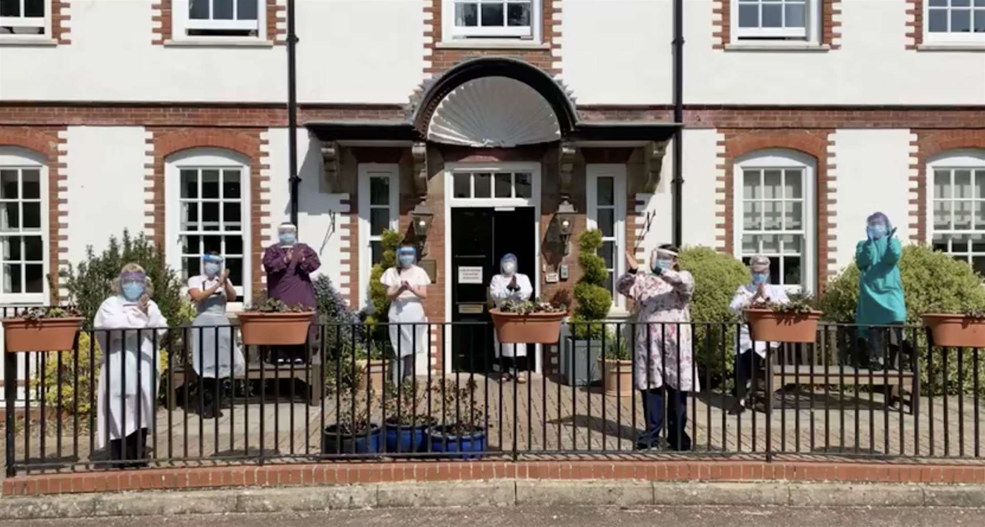 Staff at Emily Jackson House care home taking part in a 'Clap for Community Spirit'