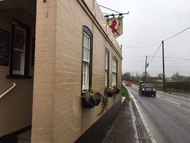 The road is shut near to the The Red Lion pub