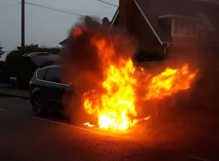 The car was engulfed in flames