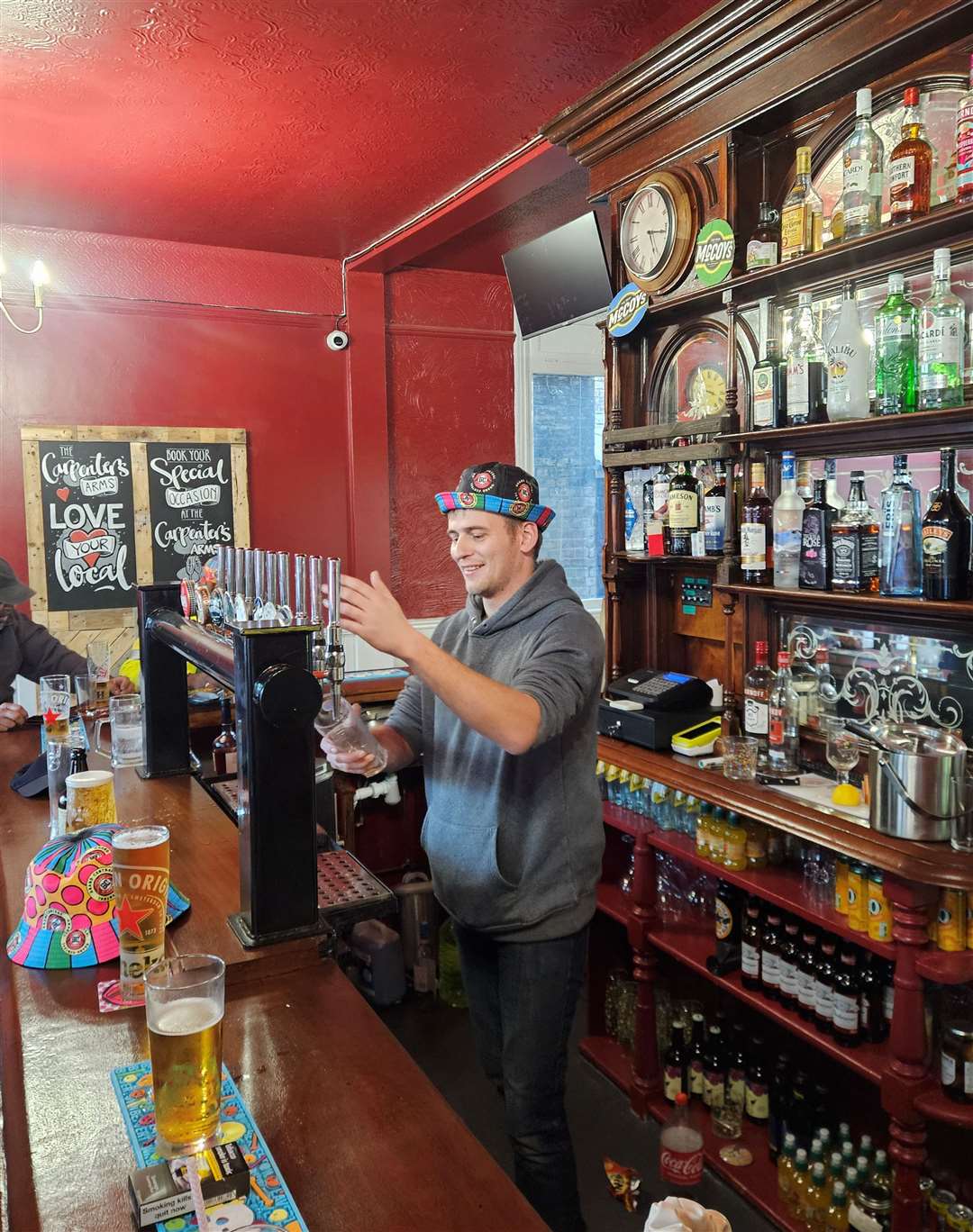 Ben Galle pulling pint behind his new bar