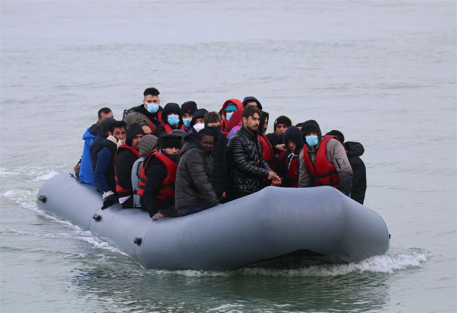 Photos show asylum seekers landing on the beach in Kent