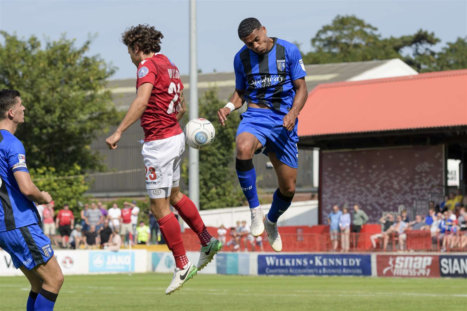 Lawrie Wilson and Bradley Garmston up for a header Picture: Andy Payton