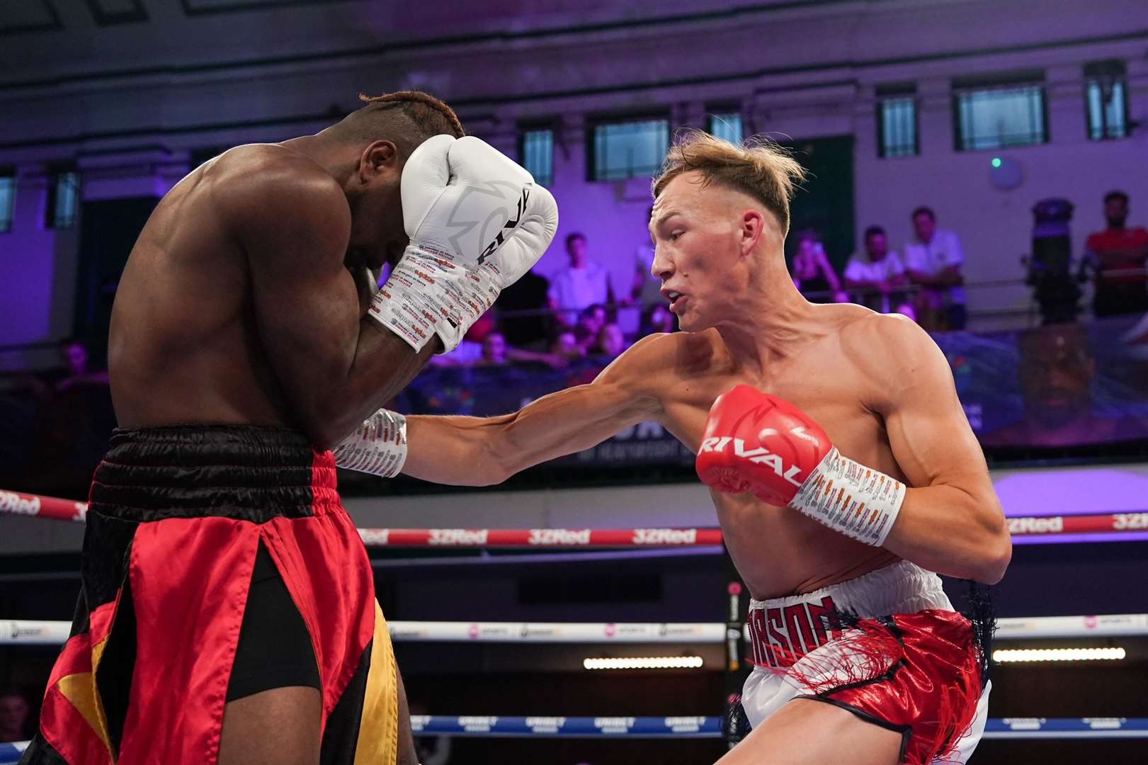 Maidstone’s Mason Payne (white trunks) gets to work against John Mosquera Picture: Stephen Dunkley/Queensberry Promotions