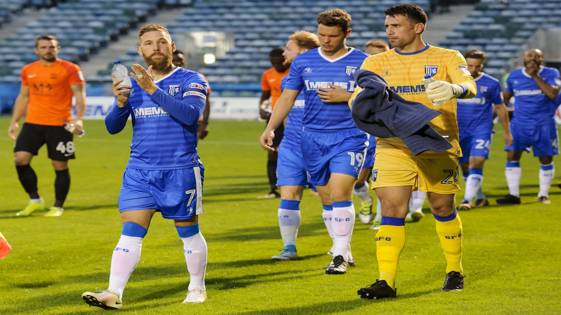 Scott Wagstaff leads the teams out at Priestfield. Picture: Andy Payton