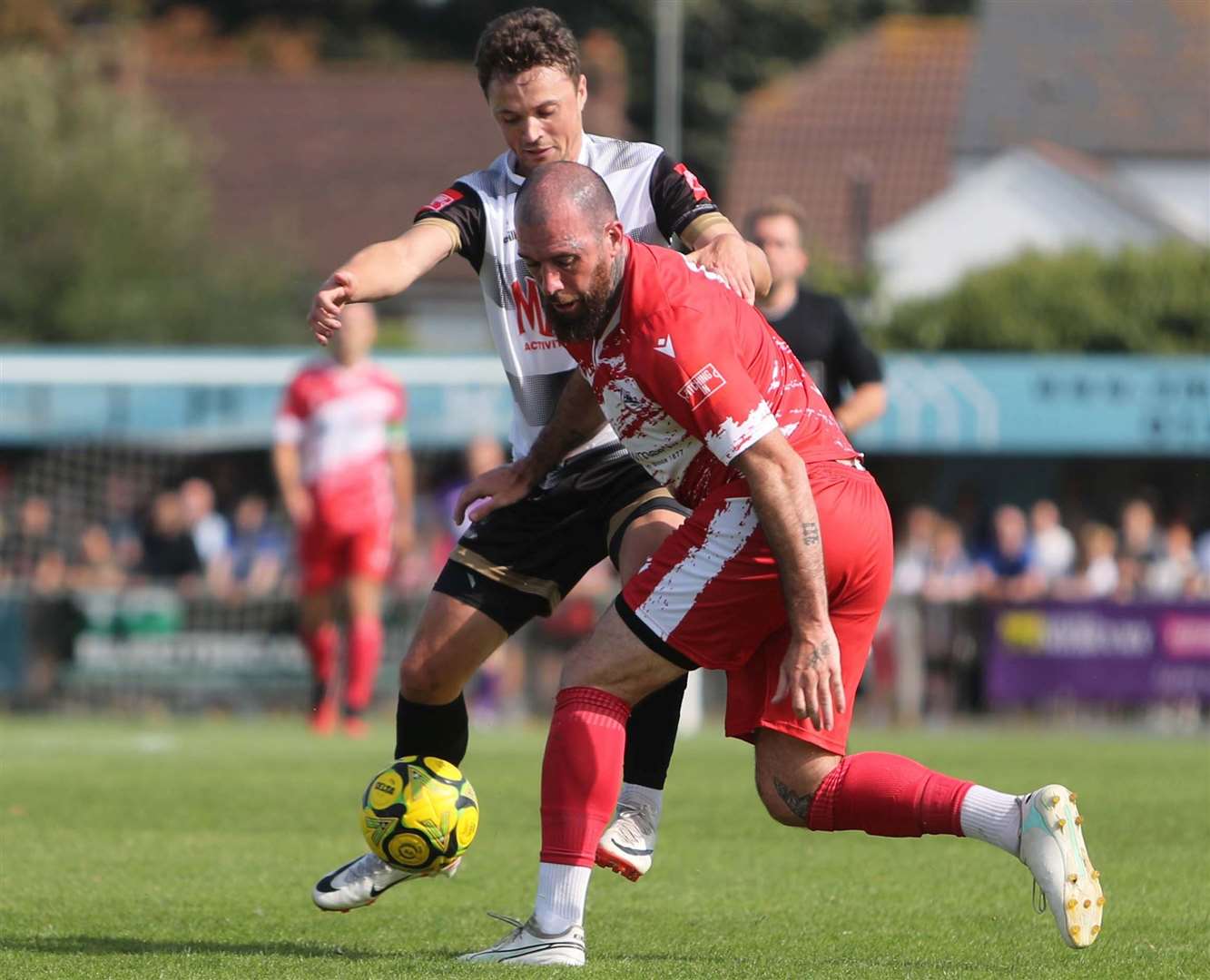 Deal's Rory Smith up against Ramsgate defender Joe Ellul. Picture: Paul Willmott