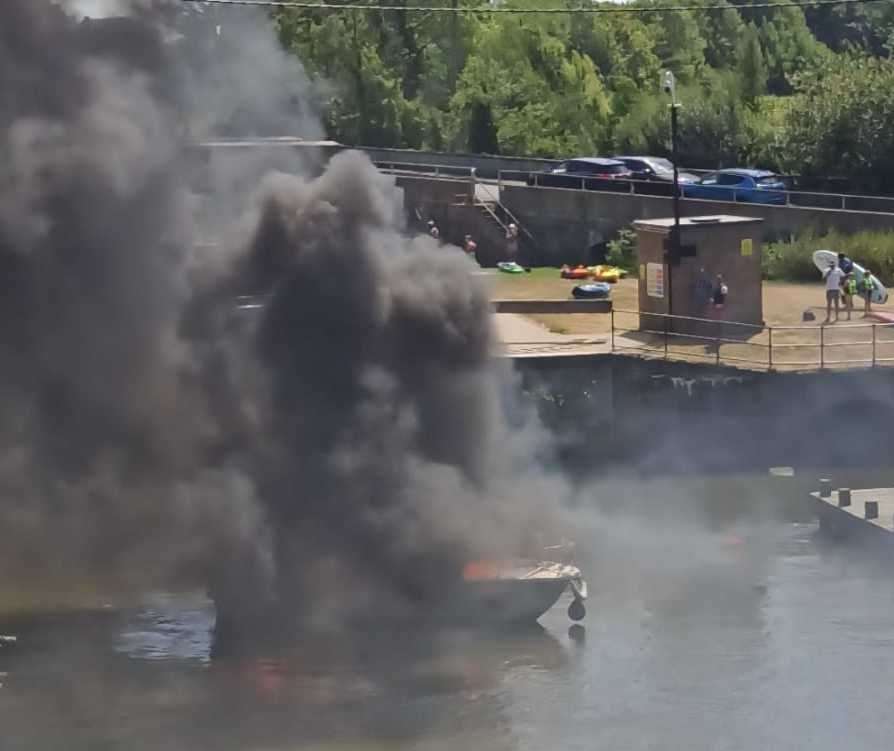 Thick, black smoke billowed from the drifting boat