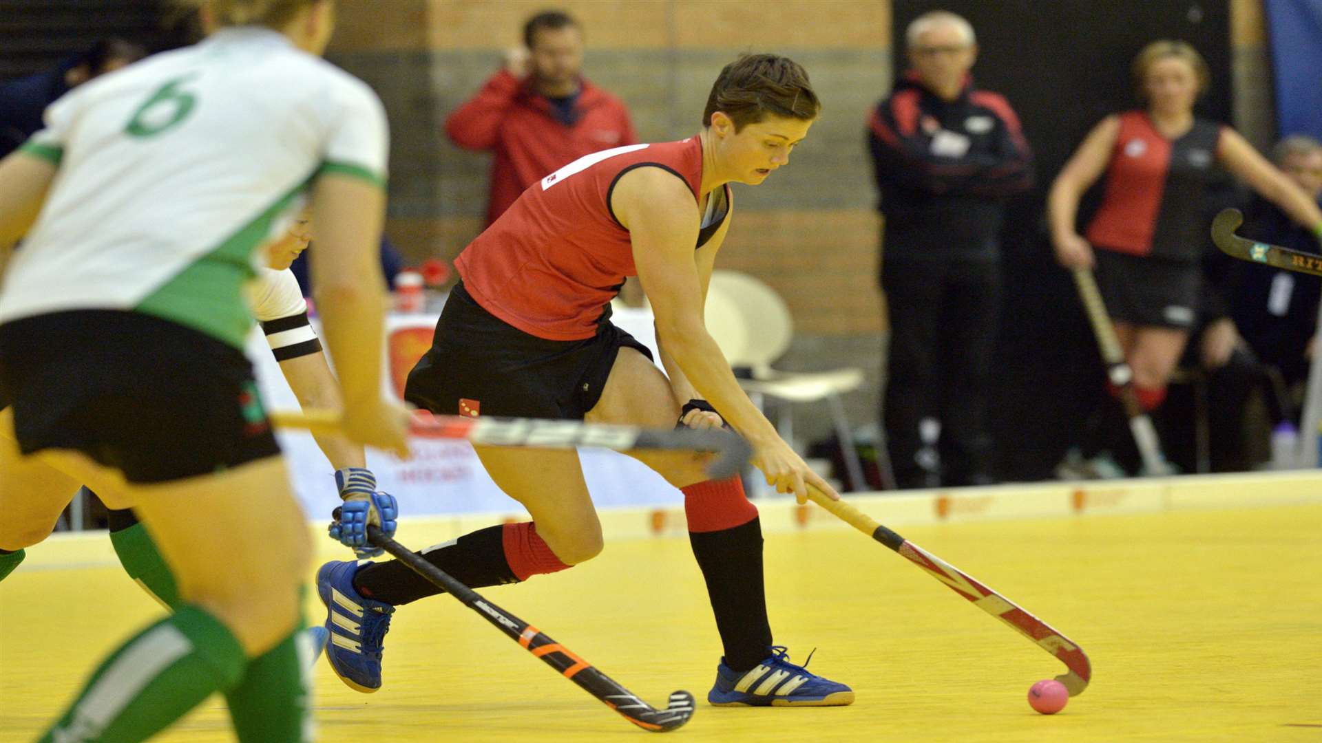 Mel Clewlow and Grace Balsdon (obscured) close down Bowdon's Sally Walton Picture: www.hockeyimages.co.uk