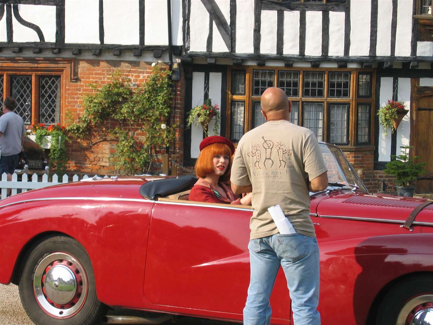 Actress Emilia Fox in discussion with a crew member during filming of Miss Marple