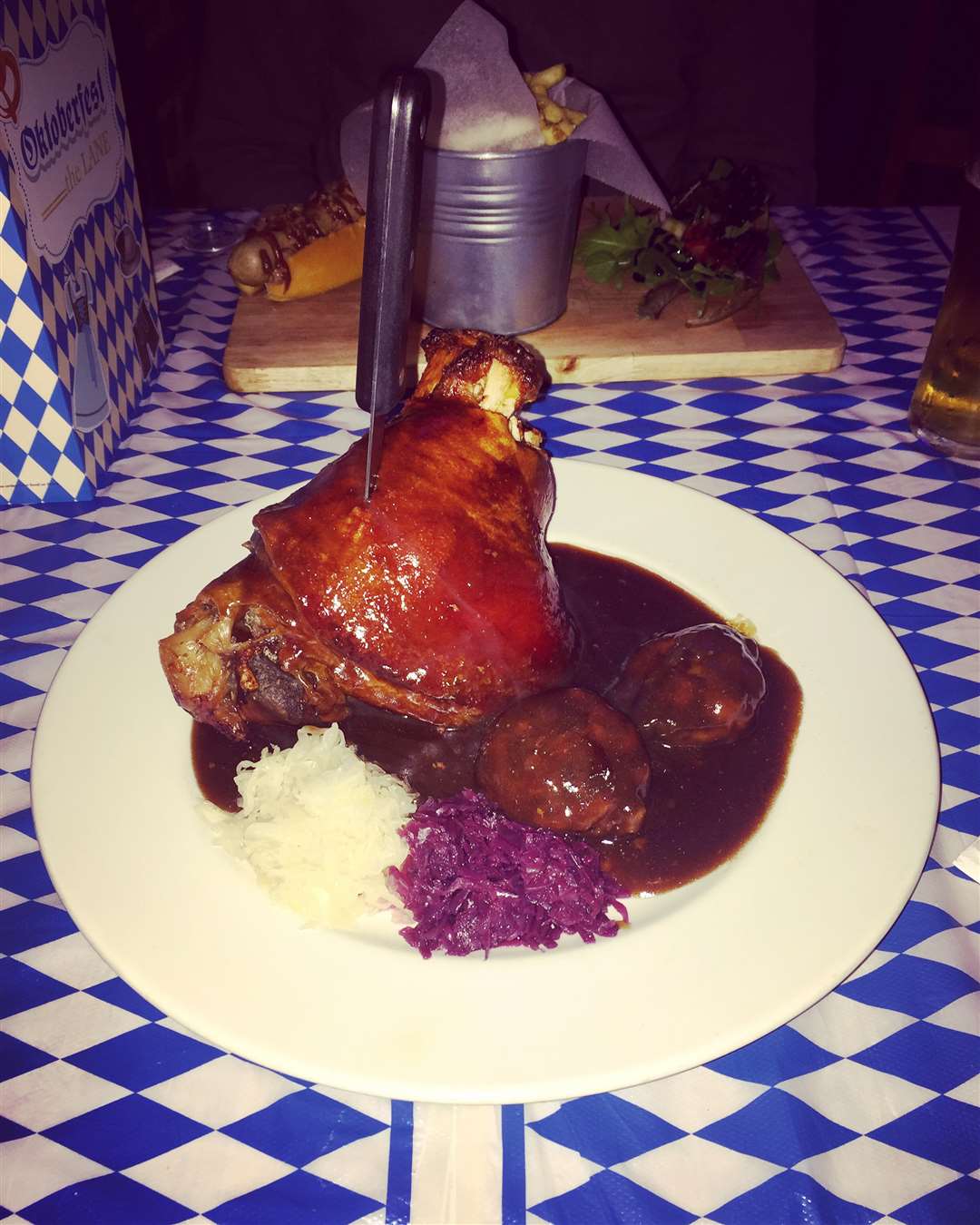 Delicious Schweinhaxe - slow cooked pork knuckle with dumplings, sauerkraut and gravy