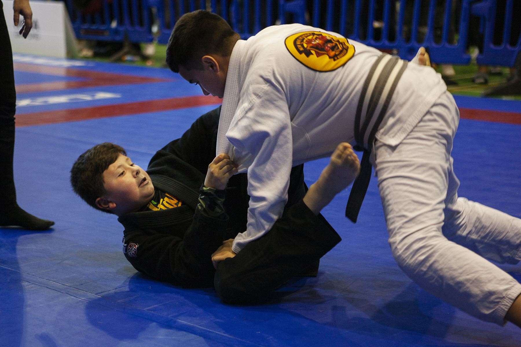 Ben Hawkes, left, grapples with his opponent