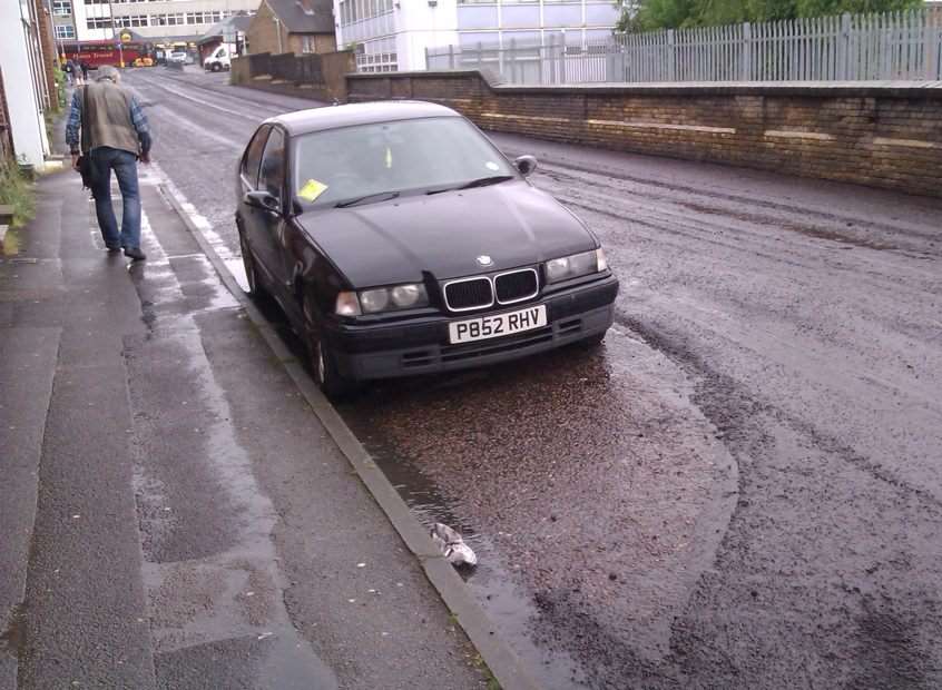 Tonbridge and Malling workmen resurfaced around this car. Picture: Chloe Williams