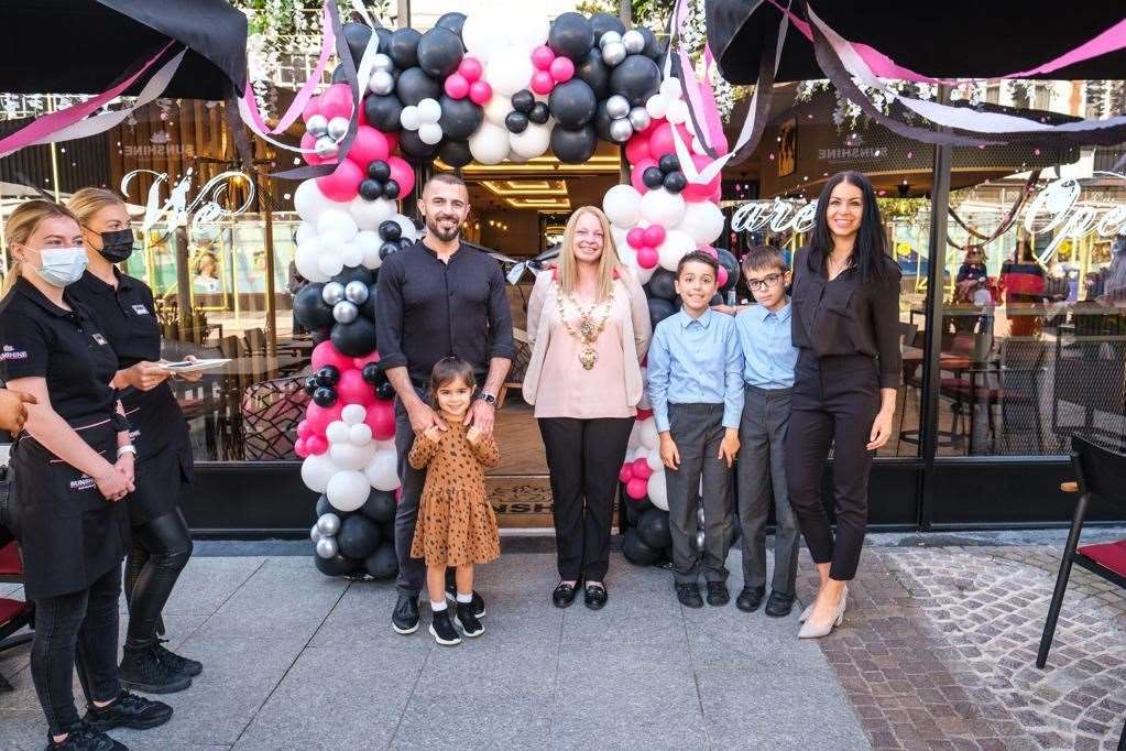 Halit and Milda Guner with daughter Kayla, sons Kenan and Ediz, and Mayor Michelle Keutenius