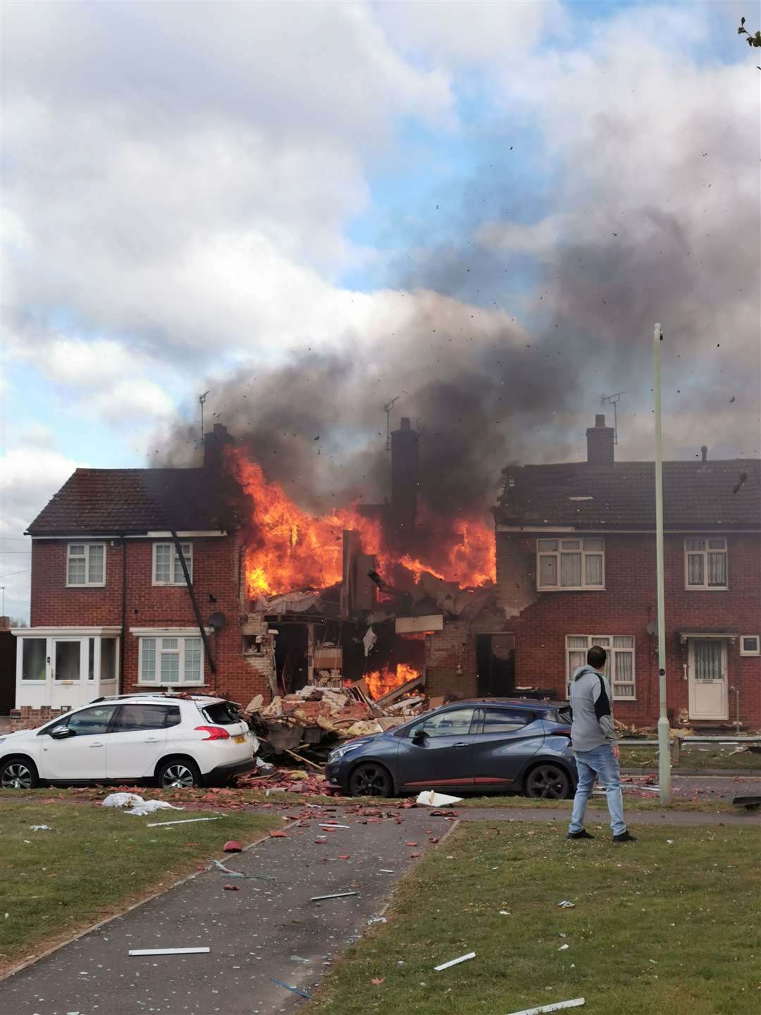 A house has been completely destroyed, with nearby homeowners being forced to evacuate while emergency services work on the scene