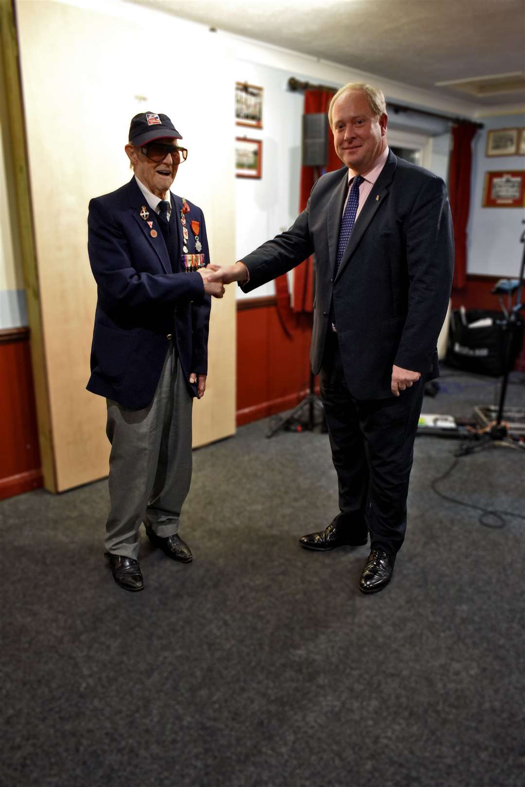 Cedric Hollands presented with medal from James Ryeland