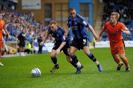 Barry Fuller and Curtis Weston try to shrug off the attention of Nicky Featherstone