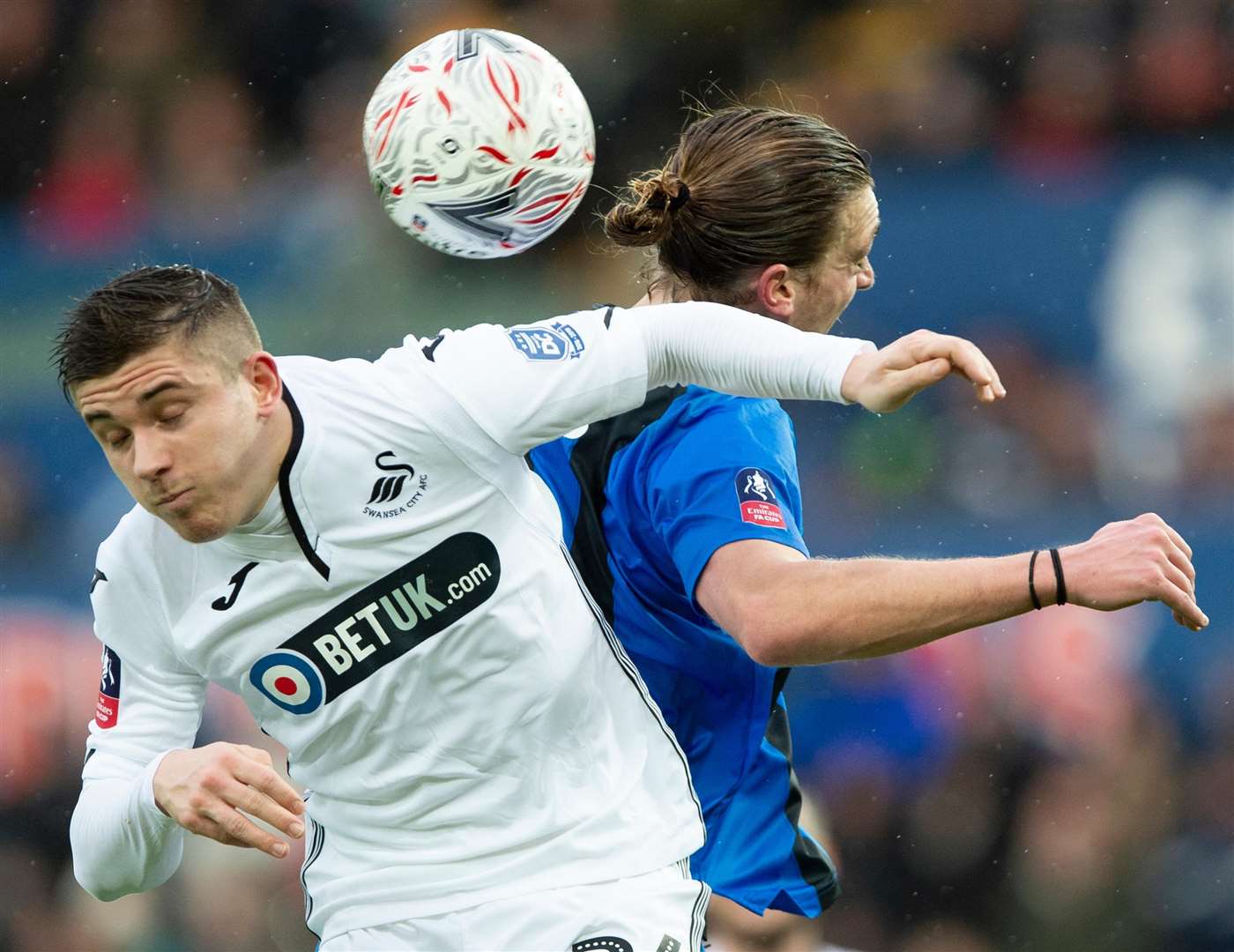 Gills striker Tom Eaves challenges with Declan John Picture: Ady Kerry