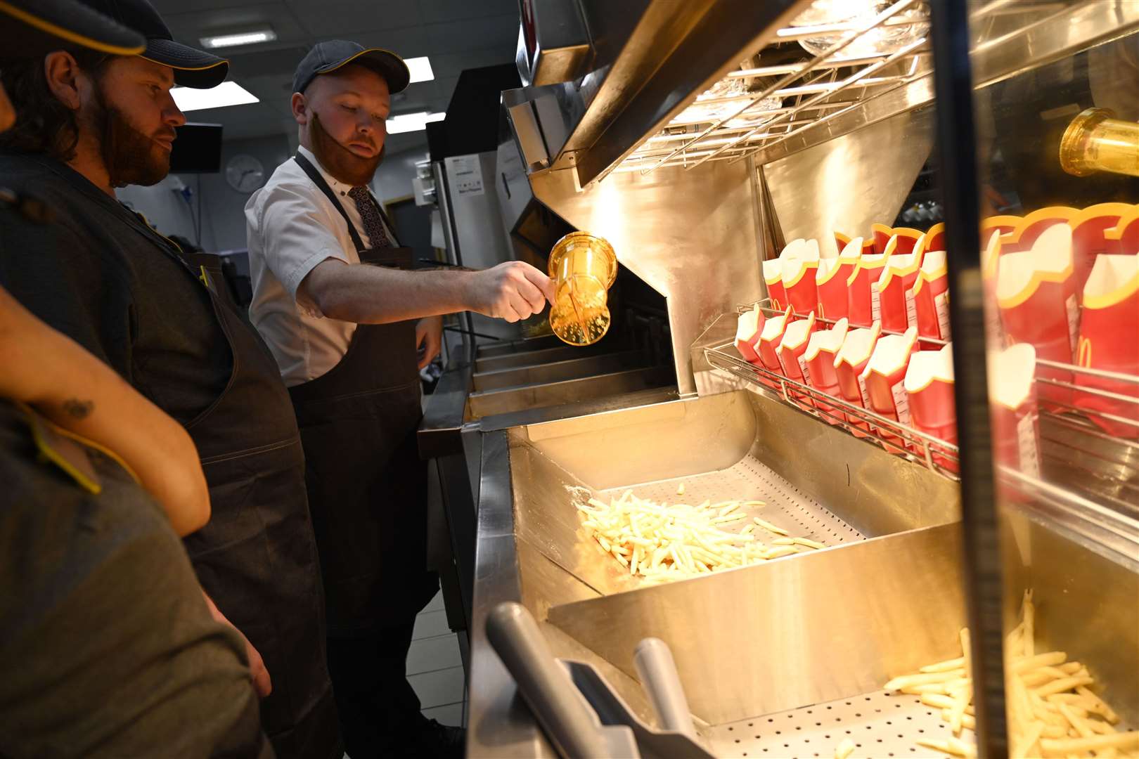 Rhys helps Sam portion up the fries