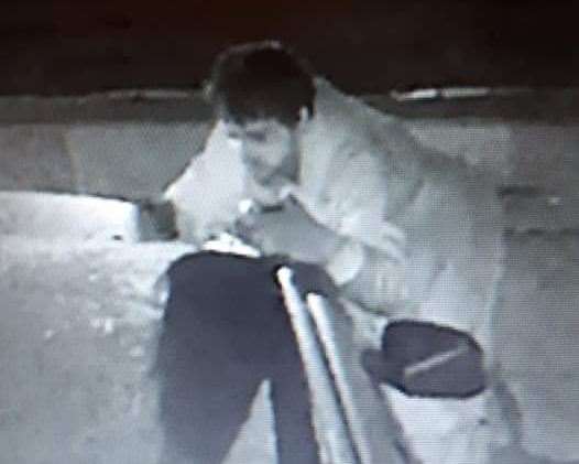 A man peers into a car in Warden Road, Rochester (11782624)