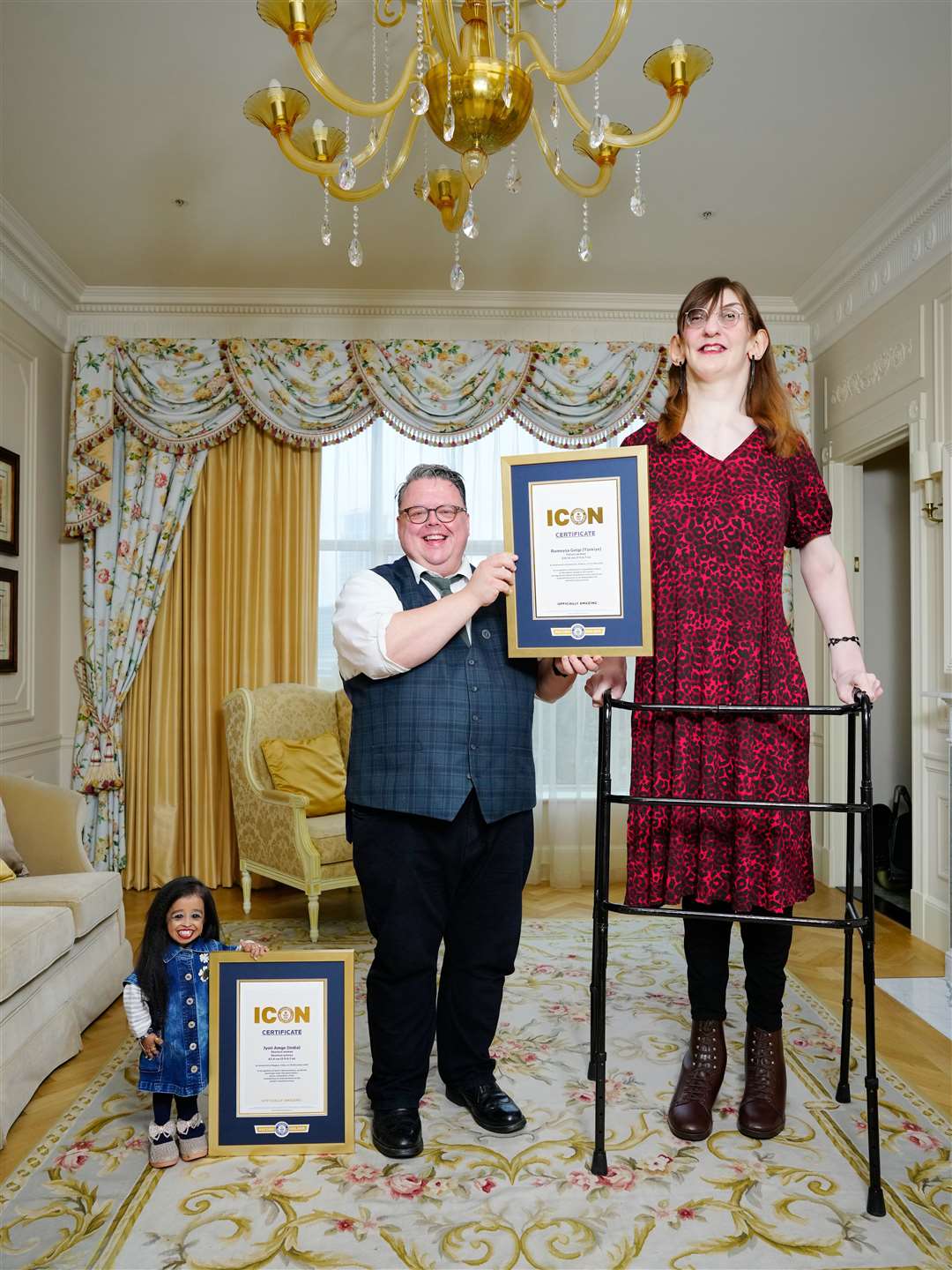 Jyoti Amge, Guinness World Records’ Craig Glenday and Rumeysa Gelgi meet for the first time and share afternoon tea (Guinness World Records/PA)