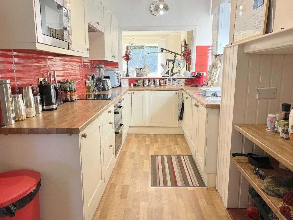 The fully fitted kitchen includes a built-in dishwasher and double oven. Picture: Cooke and Co