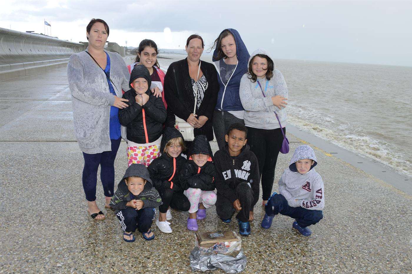 Mason Brooks, nine, with his family and friends. He discovered the casket.