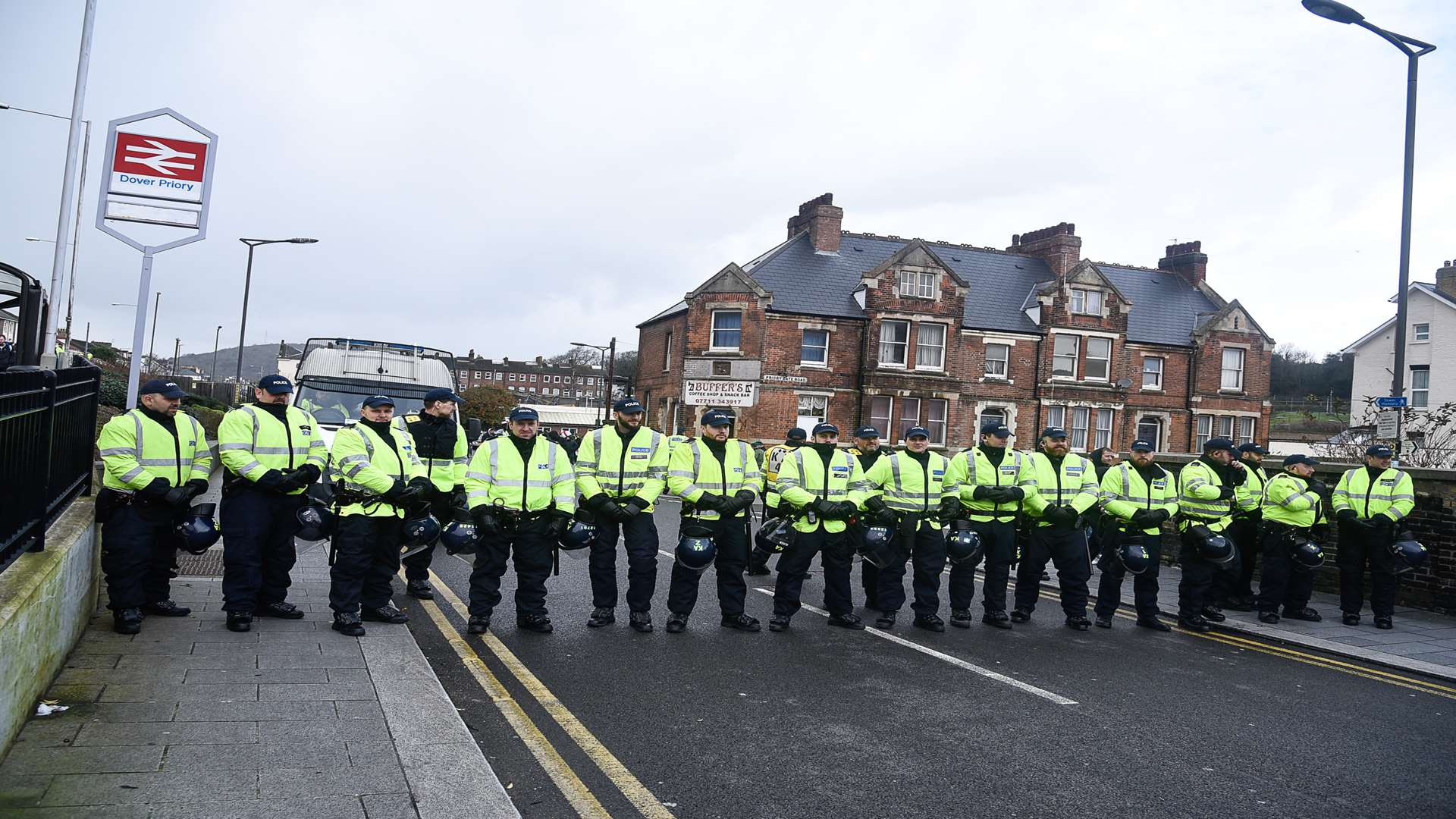 Police form a human barrier at the previous protest