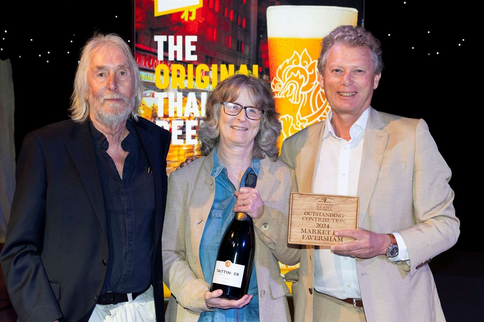 David and Suzanne receive their outstanding contribution award from chief executive Jonathan Neame after years at The Market Inn. Picture: Shepherd Neame