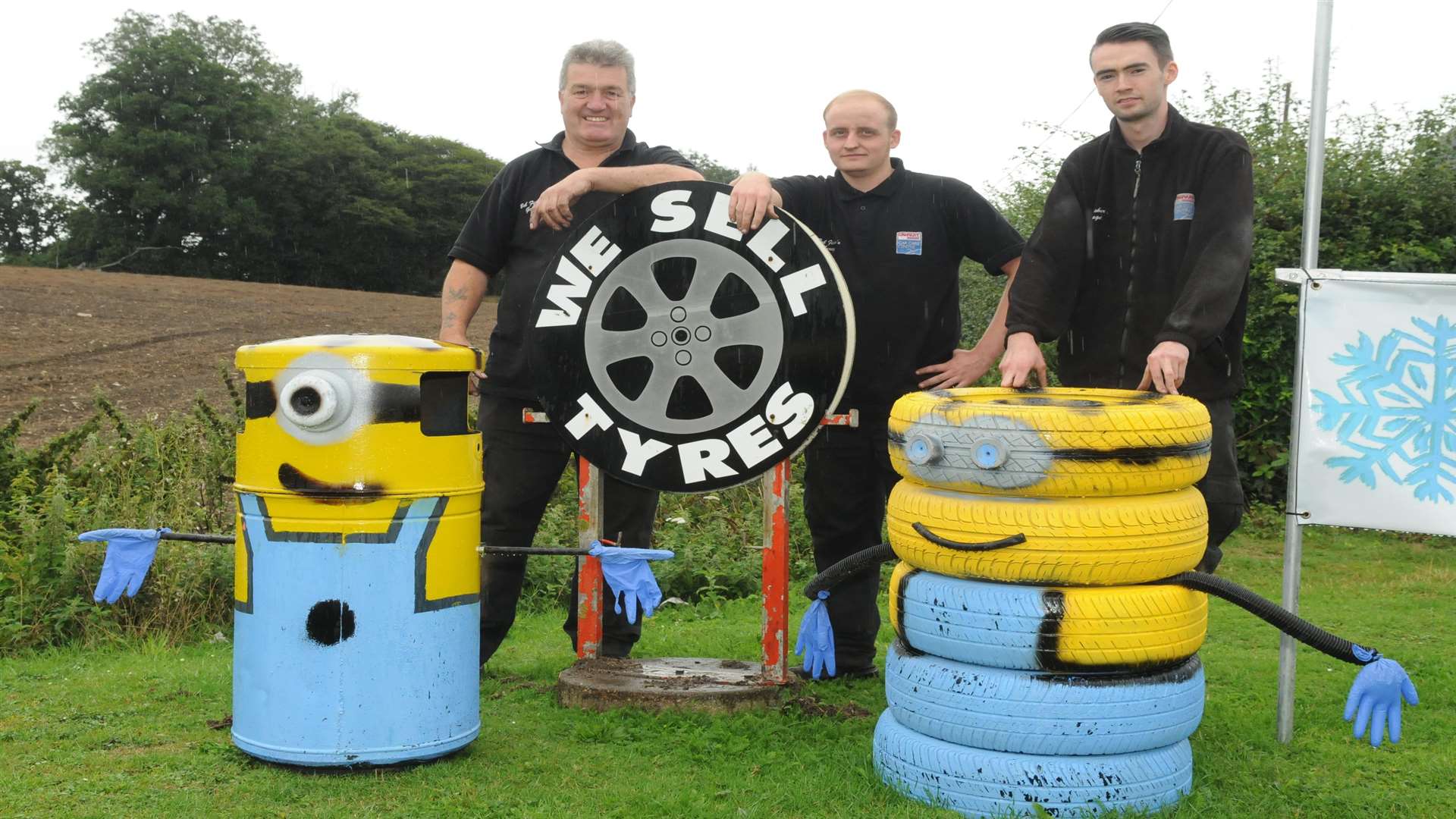 Bob Fisher, Charlie Thomas and James Marsh with their Minions at Bob Fisher's Garage