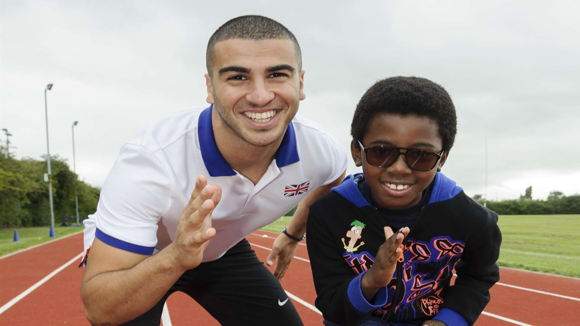 Adam Gemili with young fan Ayoola Akeju, 8