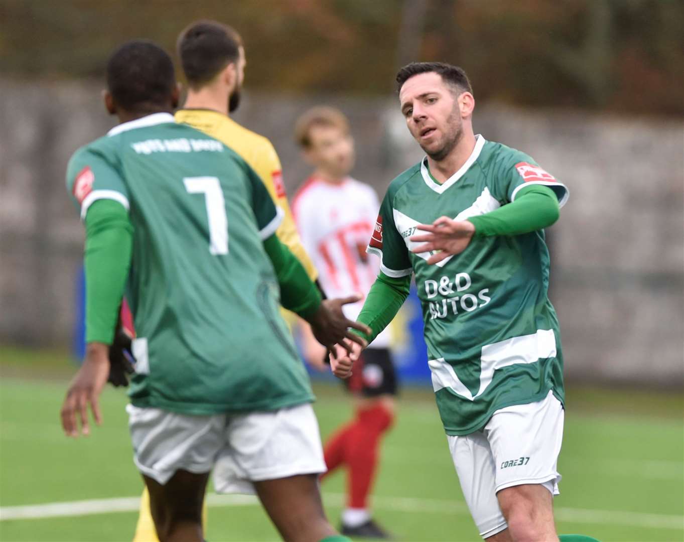 Ian Draycott, right, celebrates after launching Ashford’s fightback against Sheppey. Picture: Ian Scammell