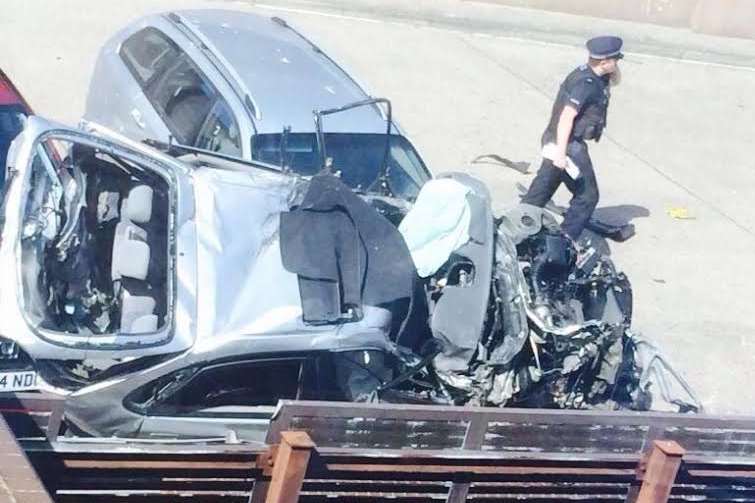 The crumpled wreckage of a car that plunged from a Dover car park roof