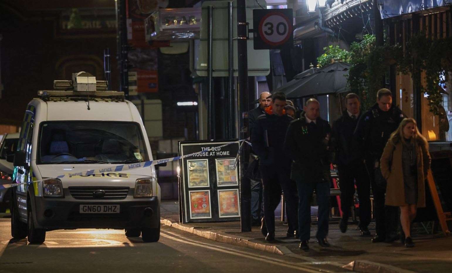 Police teams in Pudding Lane after a man was left injured. Picture: UKNIP