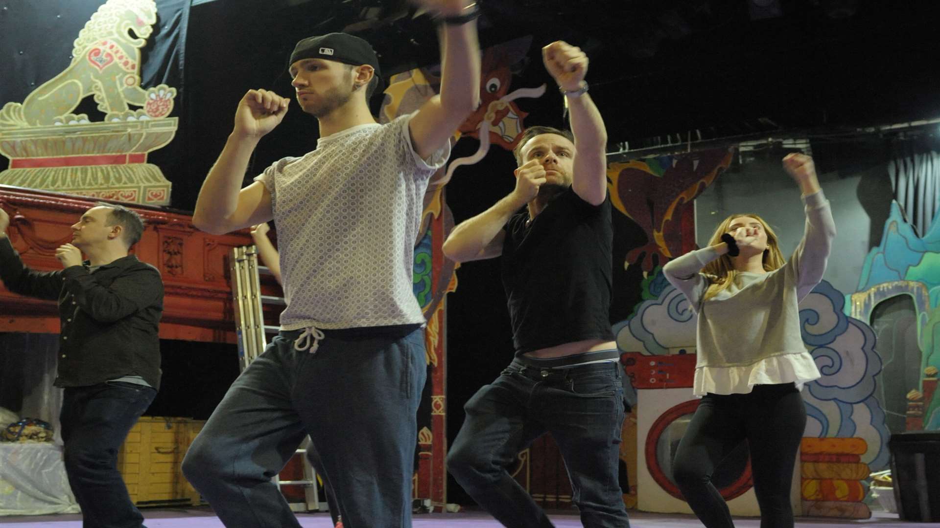 Twist and Pulse leading the cast in a dance routine in rehearsals.