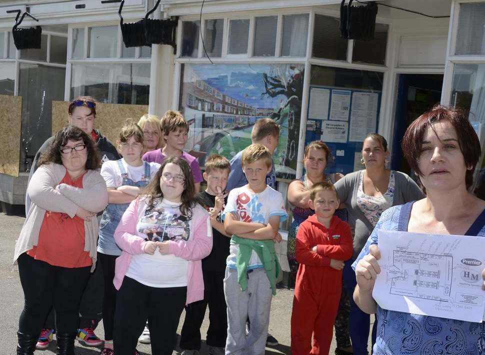 Becky Meredith with the plan of the new off licence that is opening next to the Crosslinks centre.