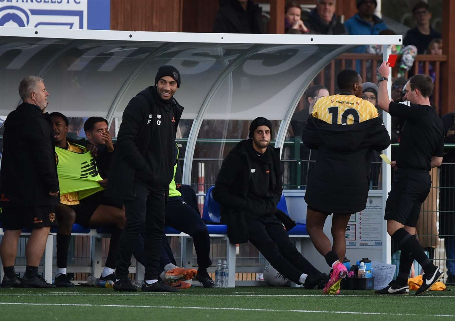 Raphe Brown, seated wearing bib, is sent off by referee Nick Dunn. Picture: Steve Terrell