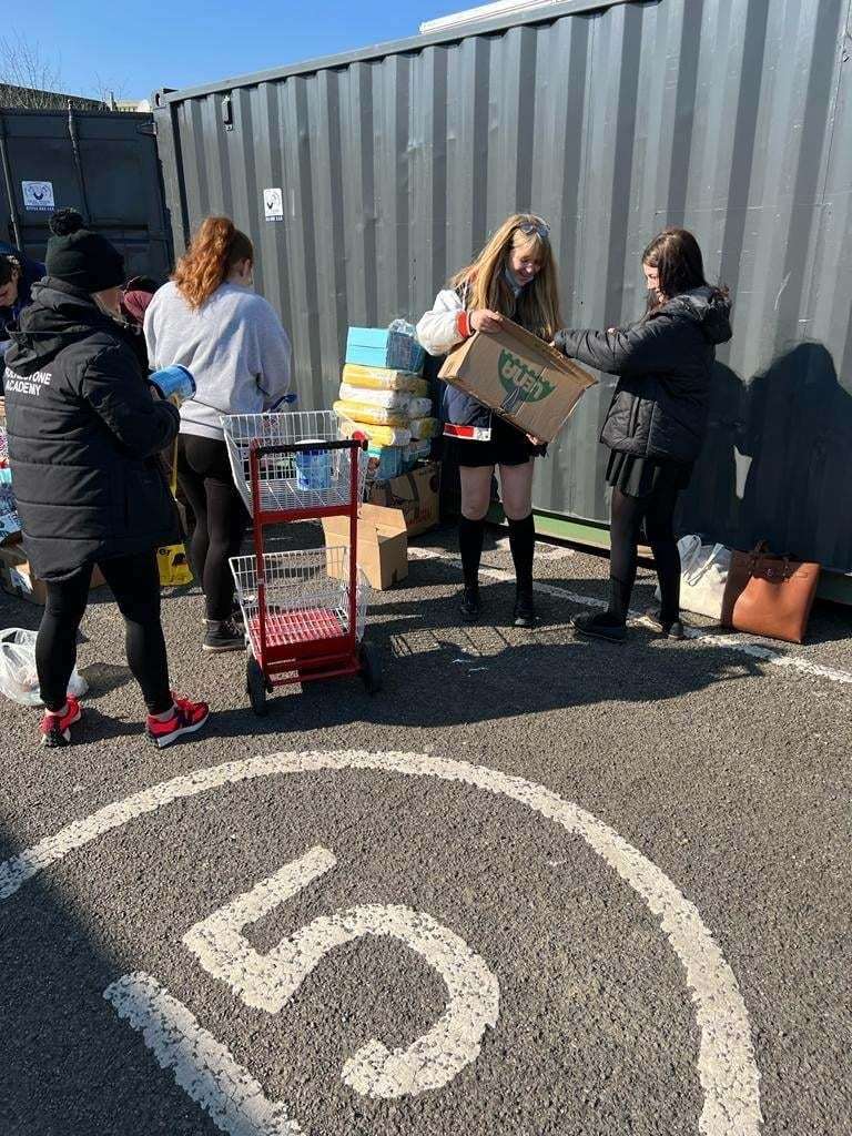 School children have been offering their lunch hour to sort through donations