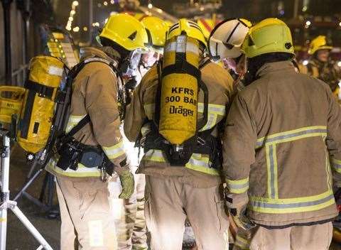 Fire crews at night. Stock picture