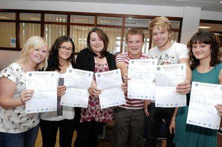 Katie Gurney, Chloe Smith, Katie Thorn, Micheal Tuffen, Jake sales and Ashley Hoskins show off their results at Herne Bay High School.