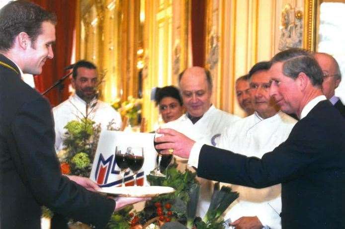 John Pettman, left, serves the King - then the Prince of Wales - at the British Embassy in Paris in 2003